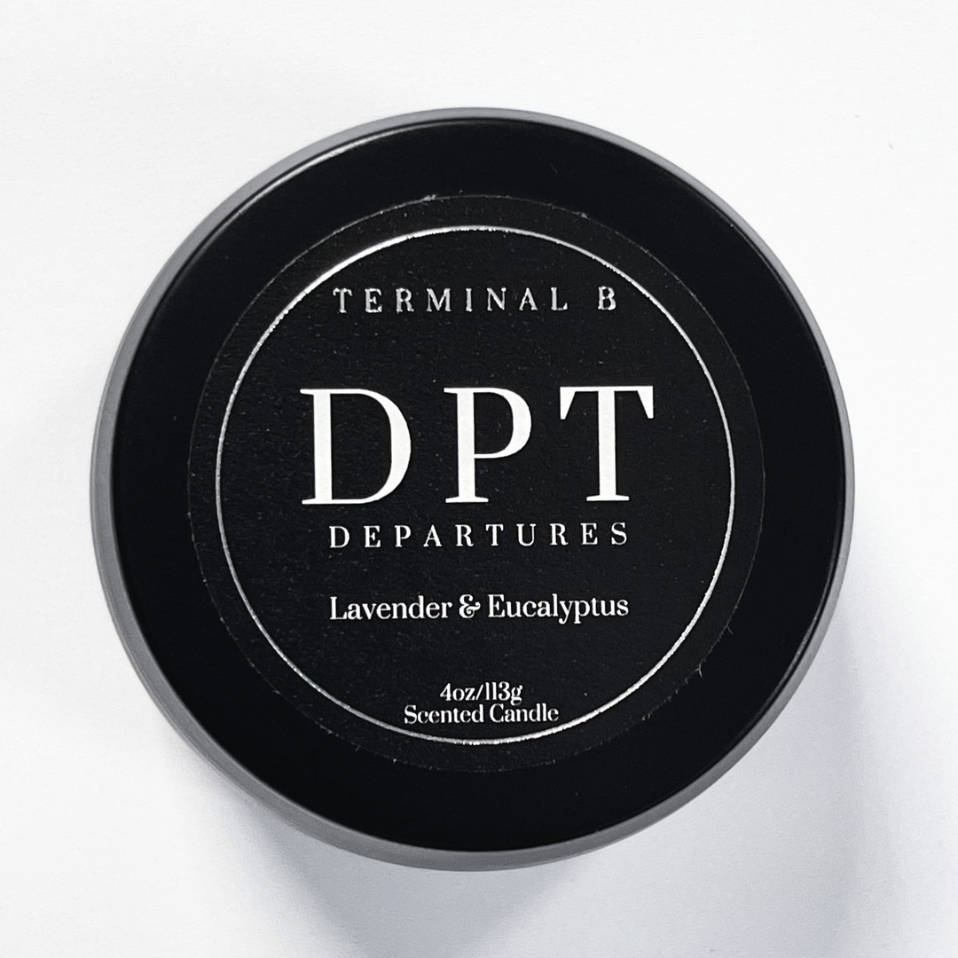 DPT-Departures 4oz Travel Tin candle by Terminal B. Lavender and Eucalyptus fragranced and displayed against a white background. Carefully designed for an elegant, long-lasting scent.