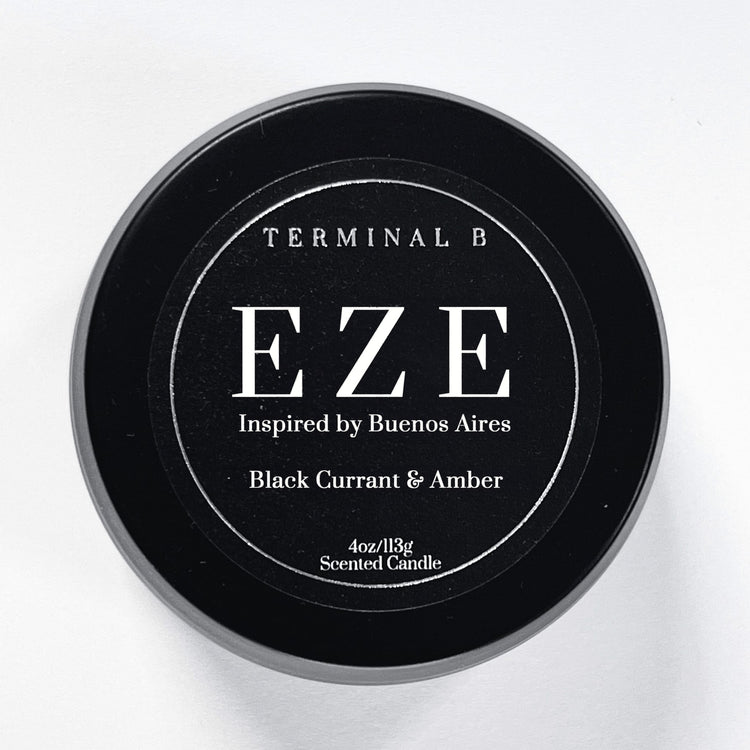 EZE 4oz Travel Tin candle by Terminal B. Black Currant & Amber fragranced and displayed against a white background. Inspired by Buenos Aires, carefully designed for an elegant, long-lasting scent.