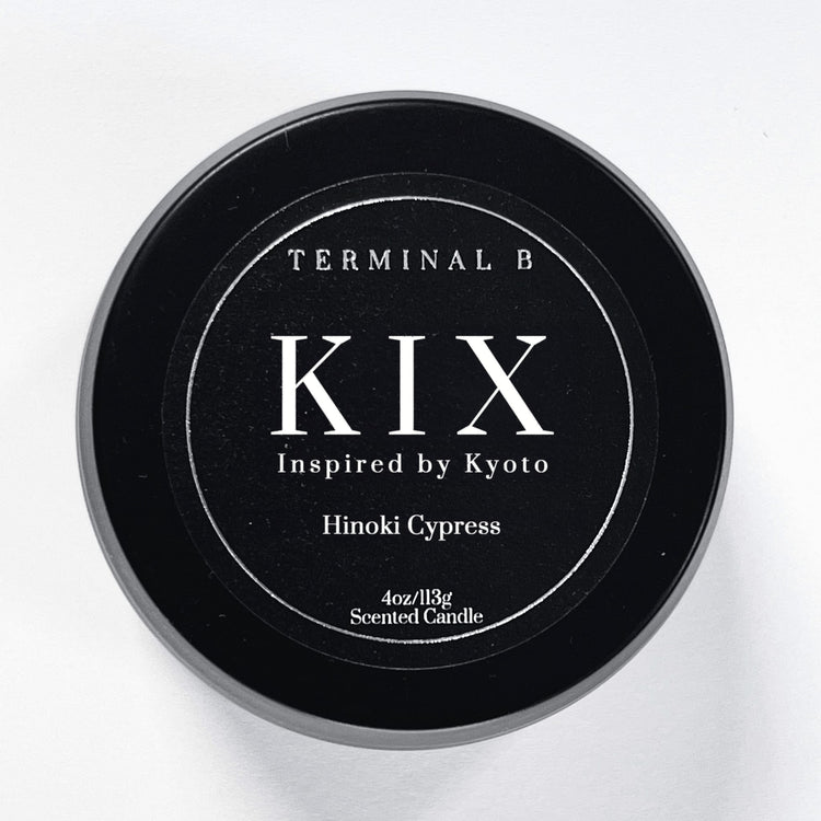 KIX 4oz Travel Tin candle by Terminal B. Hinoki Cypress fragranced and displayed against a white background. Inspired by Kyoto, carefully designed for an elegant, long-lasting scent.