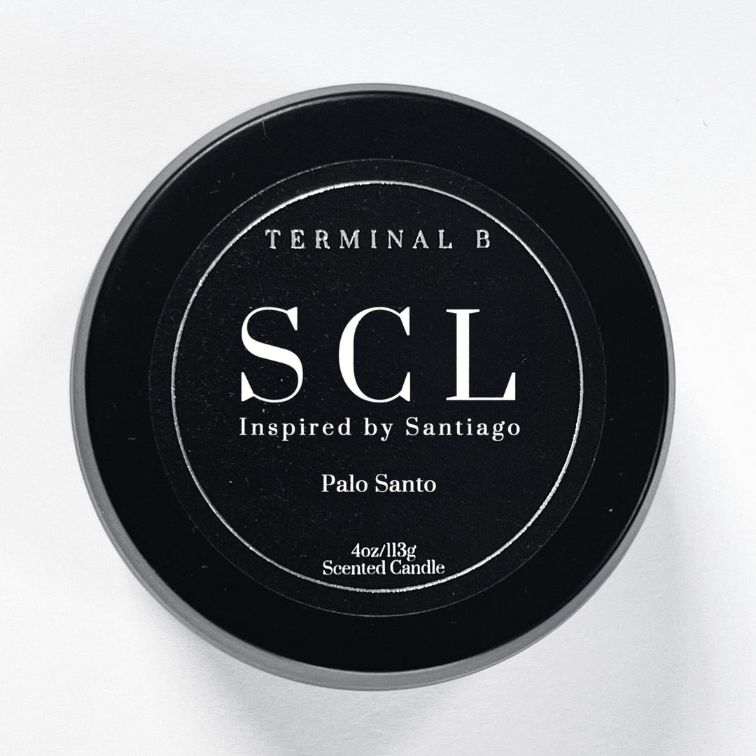 SCL 4oz Travel Tin candle by Terminal B. Palo Santo fragranced and displayed against a white background. Inspired by Santiago Chile, carefully designed for an elegant, long-lasting scent.