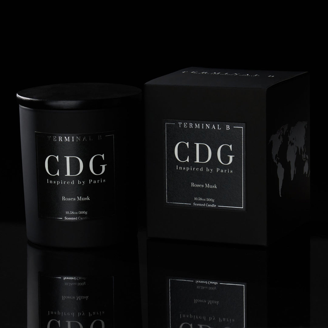 CDG luxury candle by Terminal B. A roses musk scent, displayed against a sleek black background.