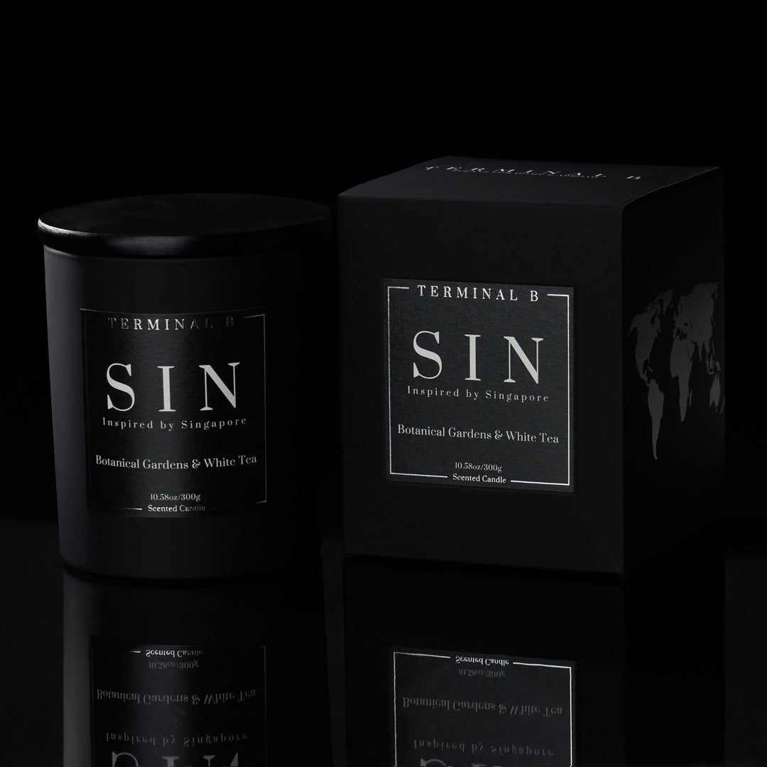 SIN luxury candle by Terminal B in Botanical Gardens & White Tea fragrance, displayed against a black background. Inspired by Singapore, carefully designed for an elegant, long-lasting scent.